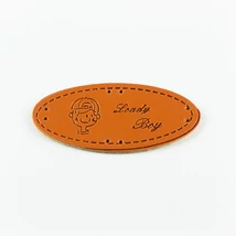 Hand made címke bőrutánzat ovális 5,7×2,5 cm fiú