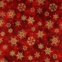 Karácsonyi pamutvászon piros batikolt alapon arany hópelyhek