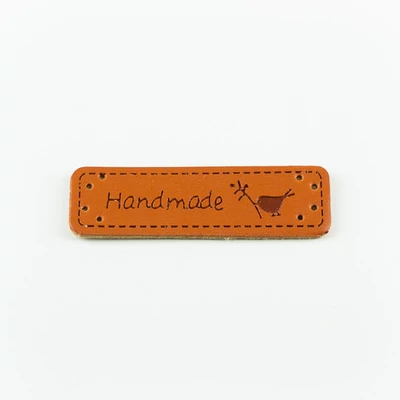 Hand made címke bőrutánzat 5×1,5 cm madárka