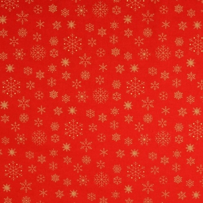 Karácsonyi pamutvászon arany hópelyhek piros alapon